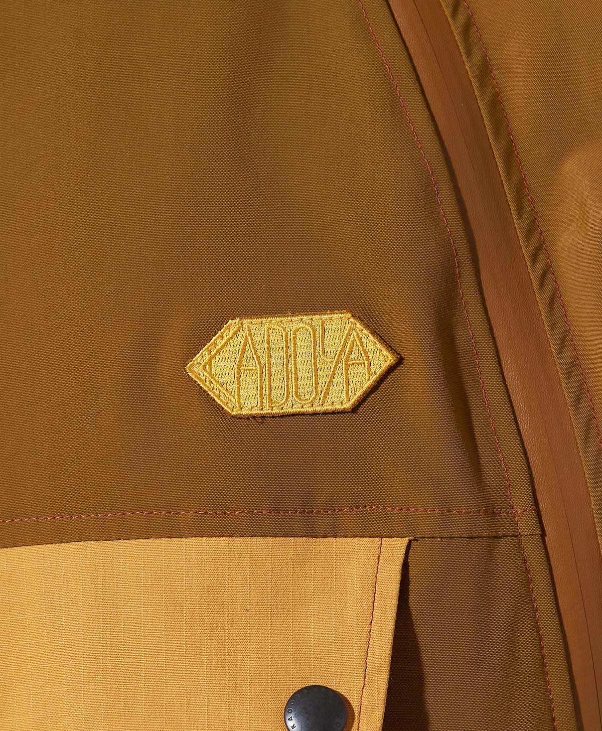 ROUND ZIP ANORAK / ブラウン
