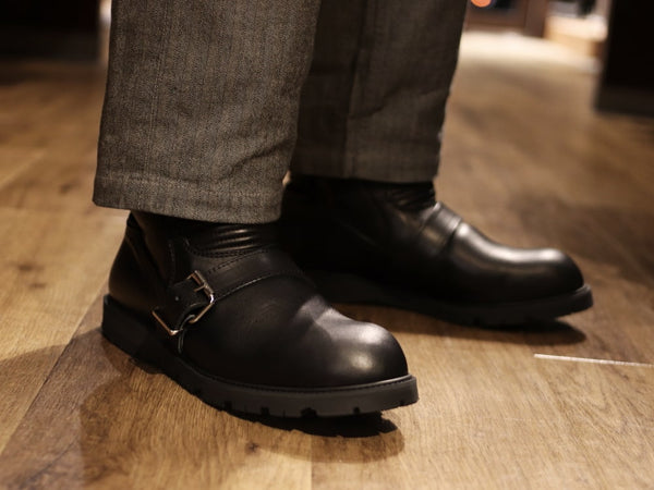 Black motorcycle boots.
